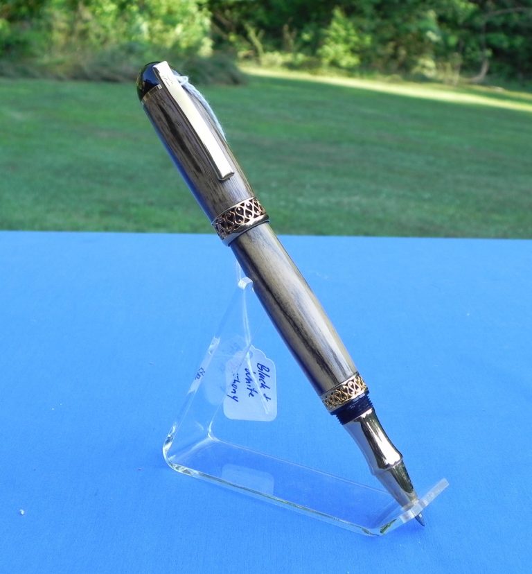 This pen features a black and white ebony body, the roller ball pen looks like a fountain pen when closed.