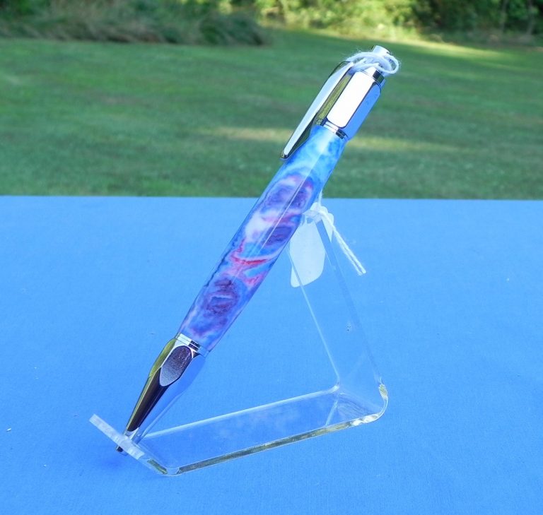 This vertex pen has a body called 'old glory' as it has red white and blue in swirls. It is radiant in the sun.