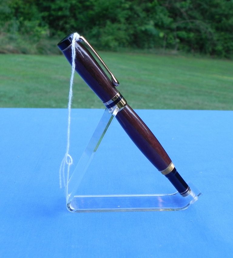 Roller ball pen with a dark wood body. Resembles the old fountain pen style.